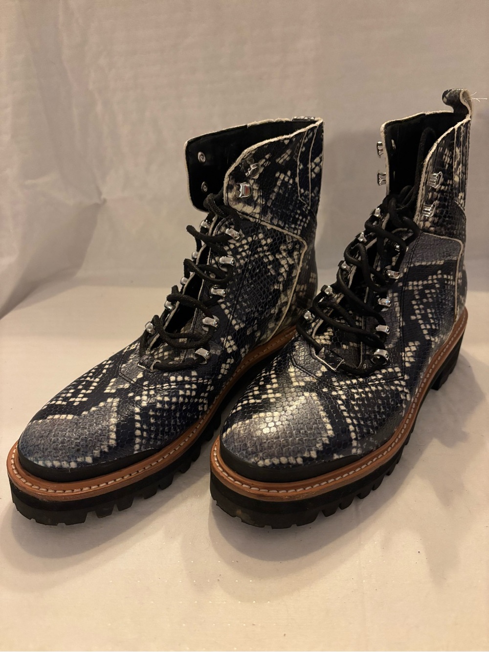 Marc Fisher Navy Snake-Print Lug Boot, excellent condition.